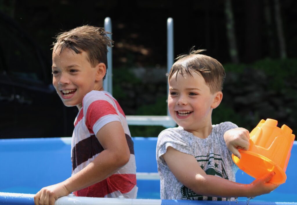 Josiah and Asher playing in pool